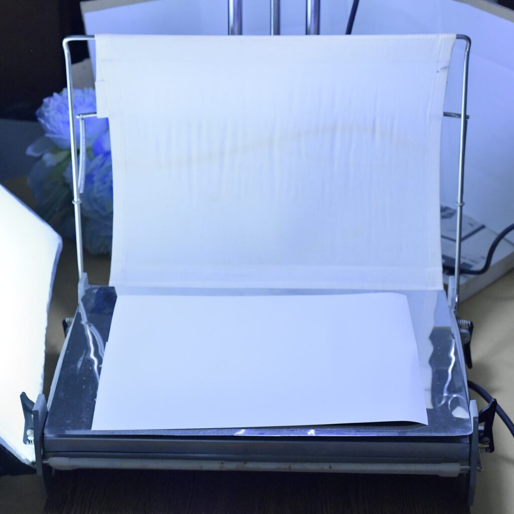 A ferrotype dryer for fiber-based paper.